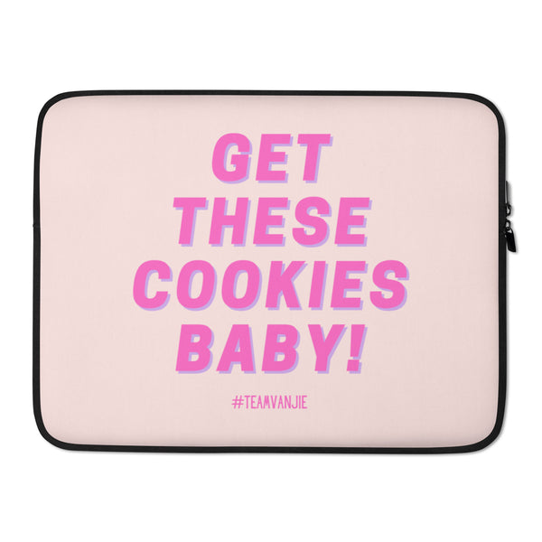 Front-facing pale pink laptop sleeve with bold pink text, “GET THESE COOKIES BABY!”
