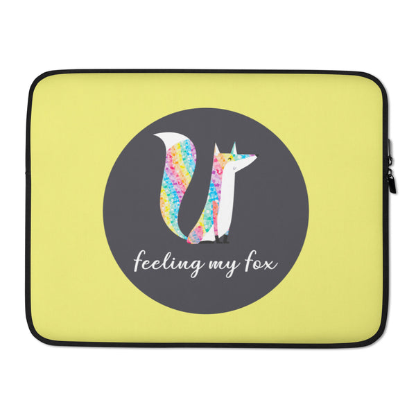Yellow laptop sleeve with a rainbow-patterned fox and “feeling my fox” text