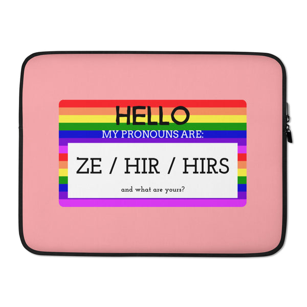 Pink laptop sleeve with rainbow stripes reading “HELLO, MY PRONOUNS ARE: ZE / HIR / HIRS”