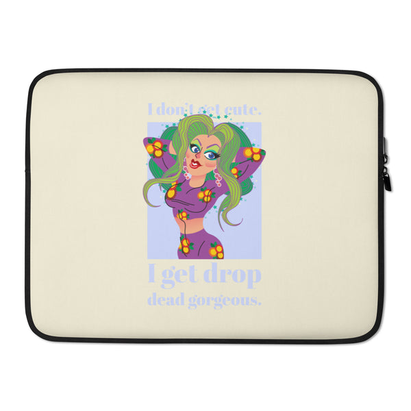 Cream laptop sleeve with black trim, pin-up-style figure, and “I get drop dead gorgeous” text
