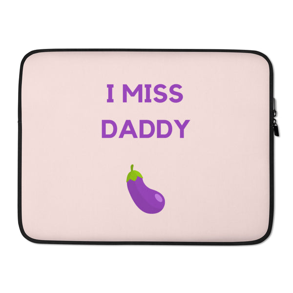 Front view of a pale pink laptop sleeve reading “I MISS DADDY” above a purple eggplant graphic