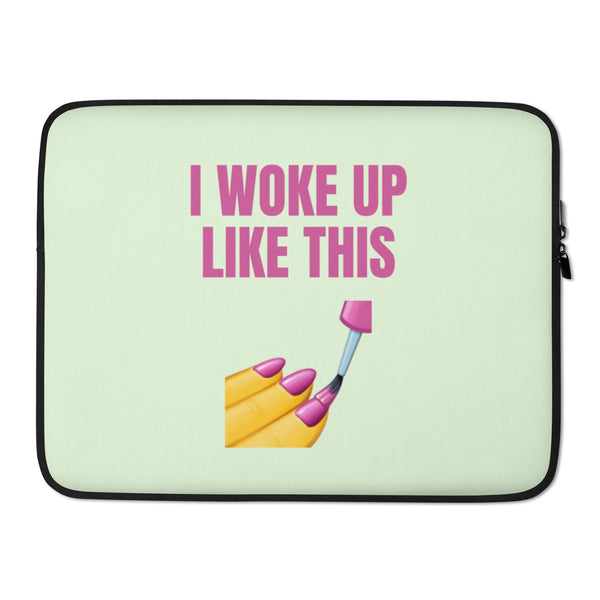 Pale green laptop sleeve with pink “I WOKE UP LIKE THIS” text and makeup graphic
