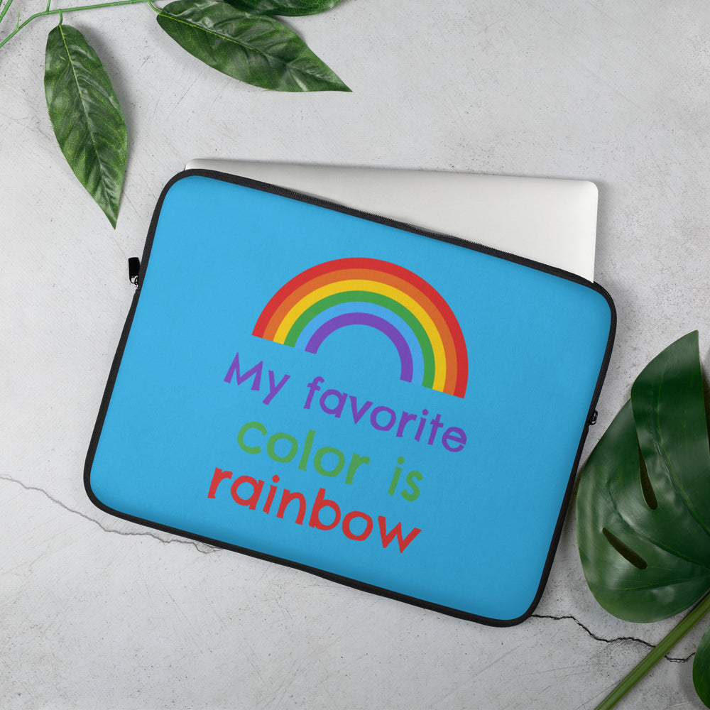 Angled blue laptop sleeve with a rainbow and the words “My favorite color is rainbow”