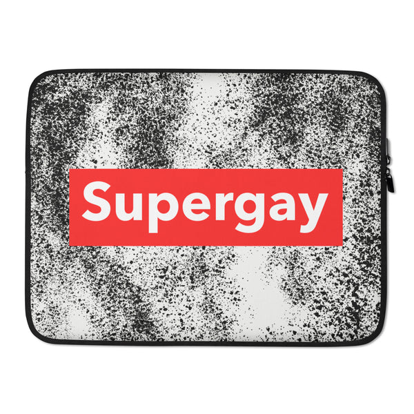 Laptop sleeve with black-and-white speckled design, red panel reading “Supergay,” and side zipper