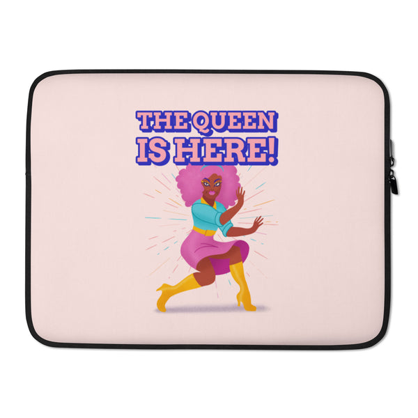 Pink laptop sleeve reading “THE QUEEN IS HERE!” with a colorful dancing woman illustration