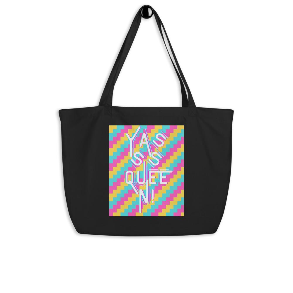 Black tote bag with colorful geometric print and large white “Yasss Queen” lettering