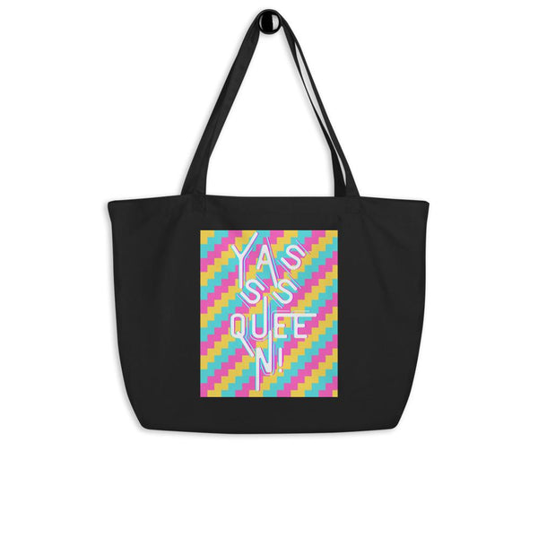 Black tote bag with colorful geometric print and large white “Yasss Queen” lettering