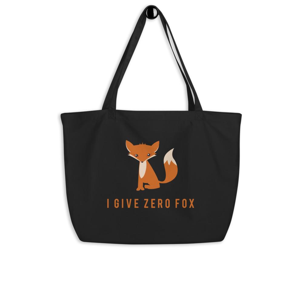 Black organic tote bag with an orange fox graphic and “I GIVE ZERO FOX” slogan