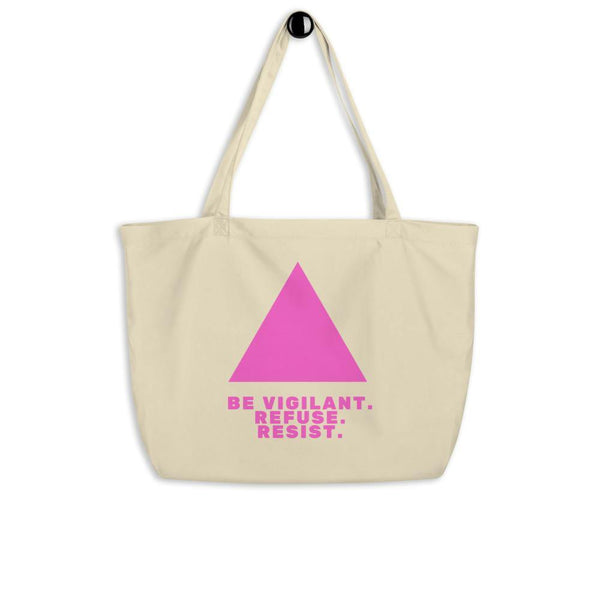 Large cream tote bag with pink triangle and “BE VIGILANT. REFUSE. RESIST.” slogan