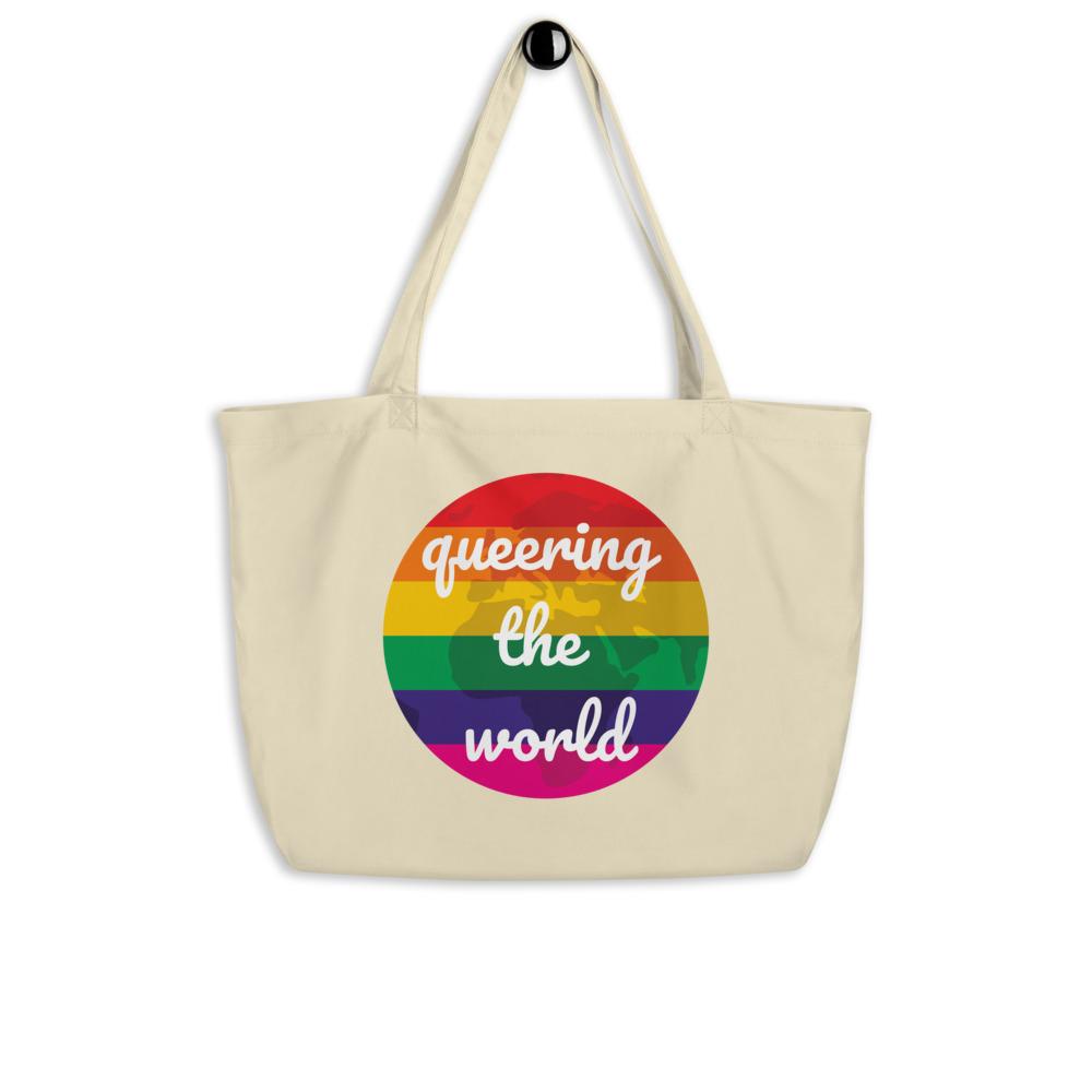 Cream organic tote bag with rainbow circle reading “queering the world”