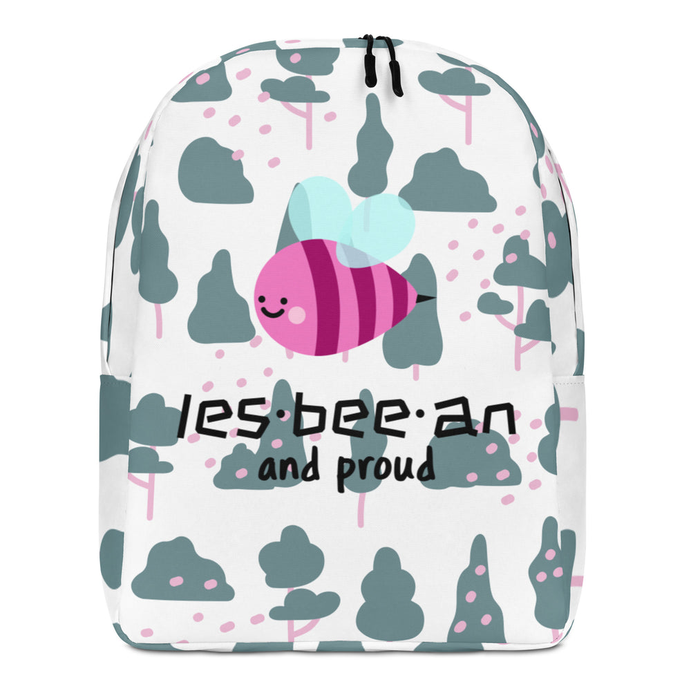 Front view of a white backpack with a smiling pink bee, trees, and “les-bee-an and proud” text