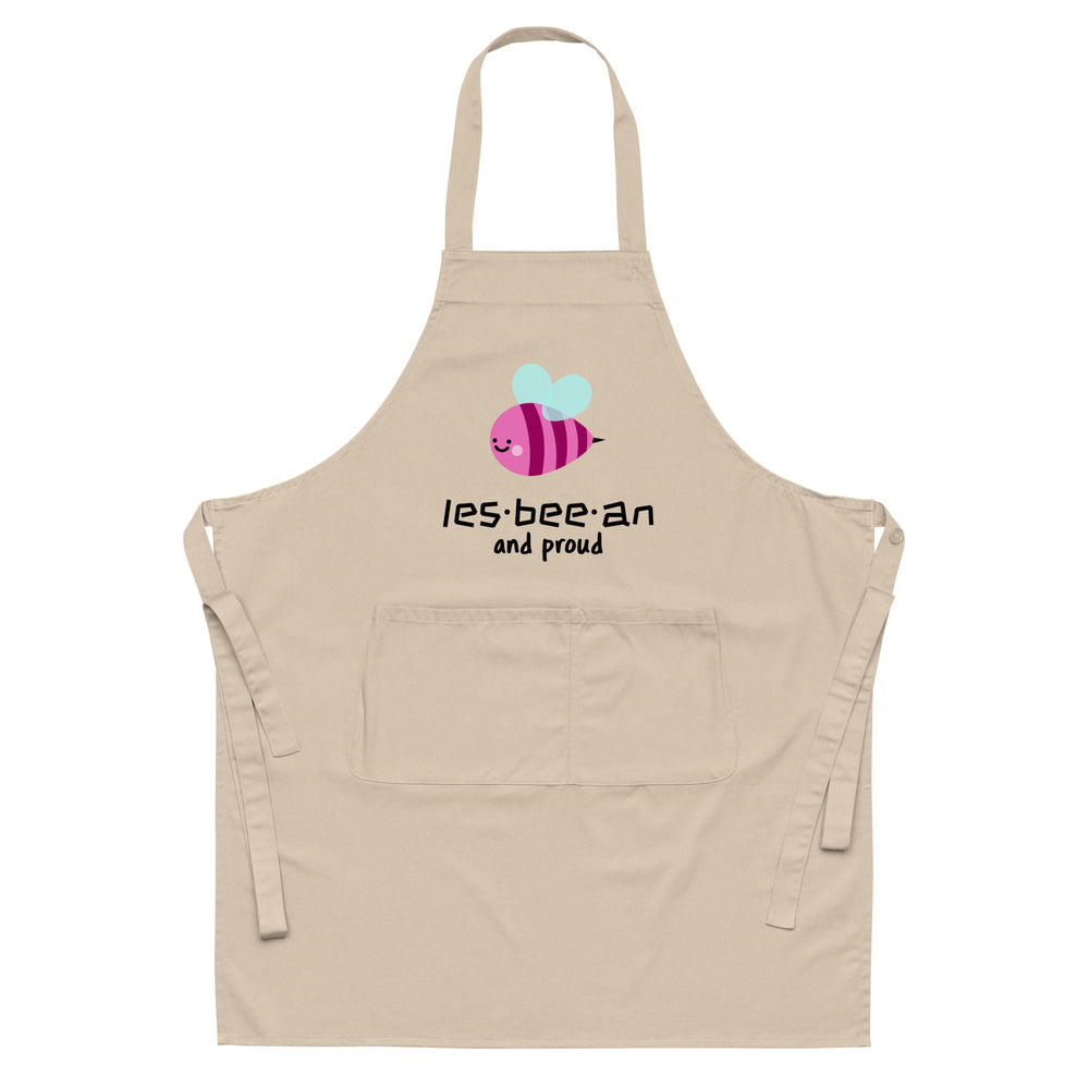 Beige apron with a pink bee graphic, “les·bee·an and proud” text, and front pocket