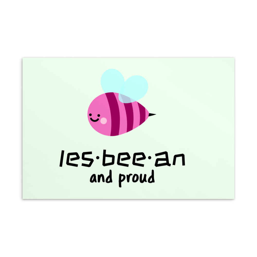 Postcard with a smiling pink striped bee and the words “les-bee-an and proud”