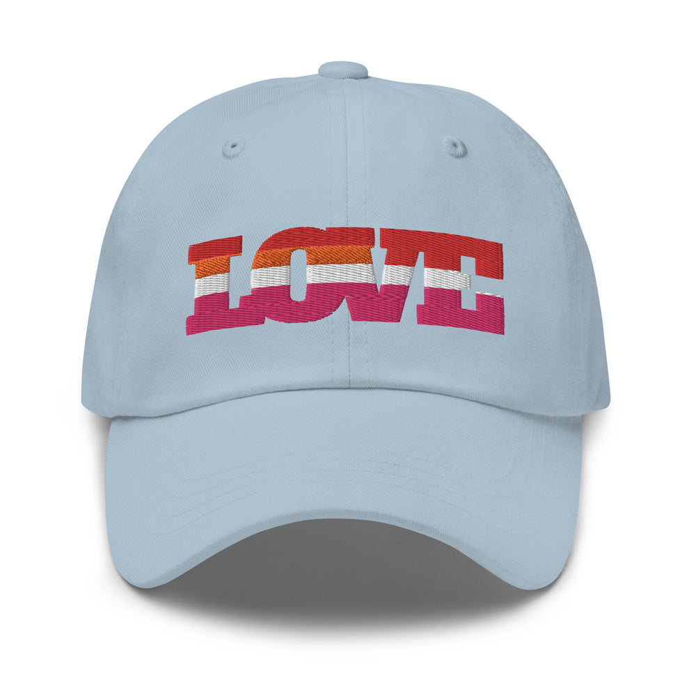 Front view of a light blue cap embroidered with “LOVE” in lesbian pride colors