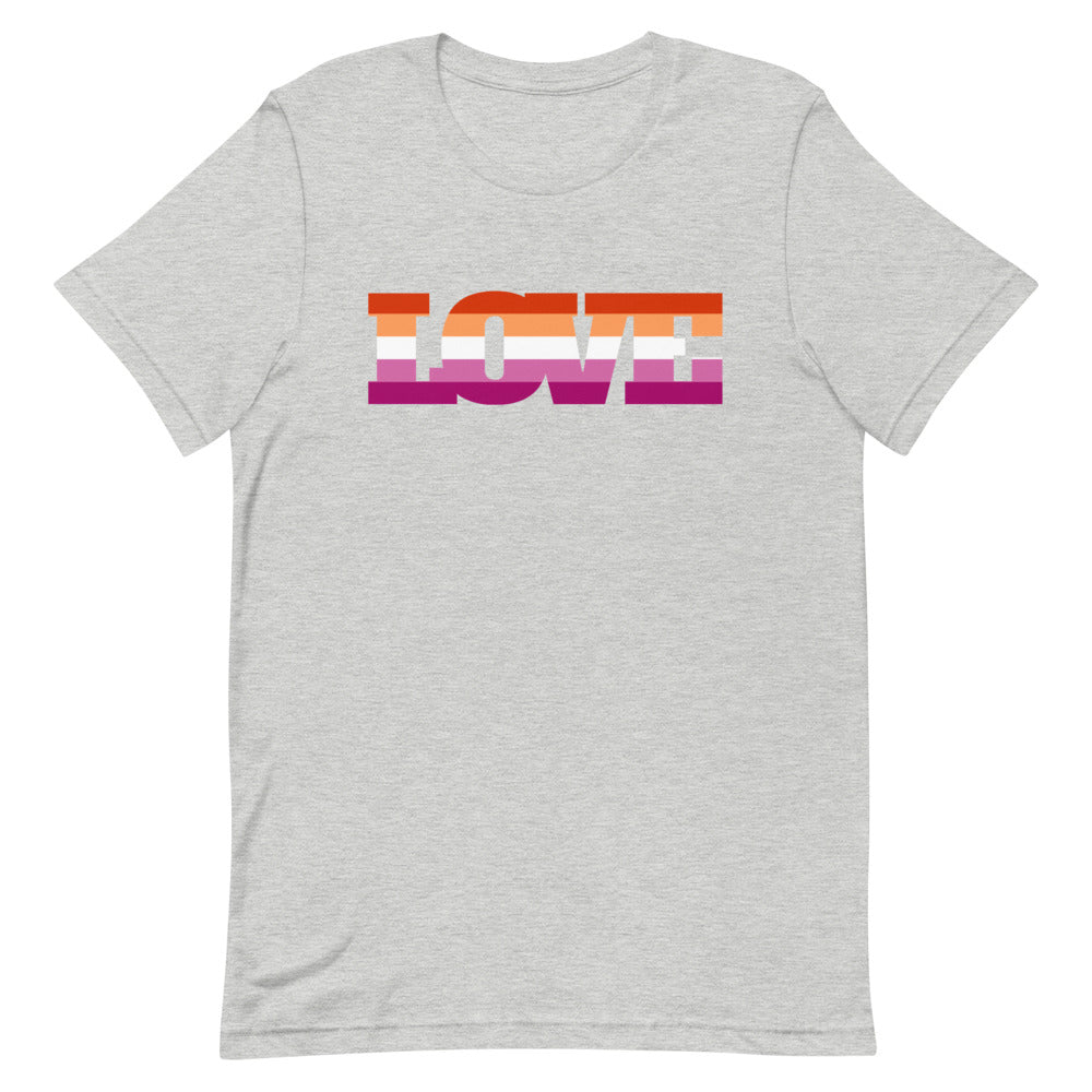 Light gray Lesbian Love T-Shirt with "LOVE" on the chest in orange, pink, and purple stripes; person indoors with soft shadows.