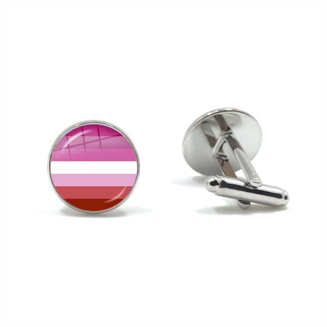 Pair of round silver cufflinks, one displaying pink, white, and red horizontal stripes