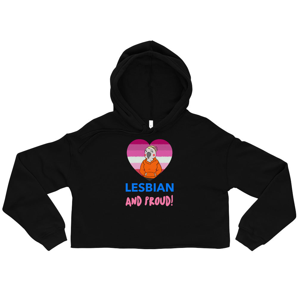 Front view of a black cropped hoodie reading “LESBIAN AND PROUD!” with a pink-striped heart graphic