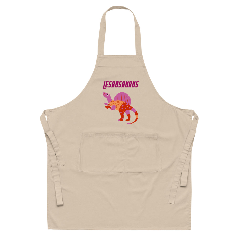 Front view of a beige apron with a colorful dinosaur graphic and two front pockets