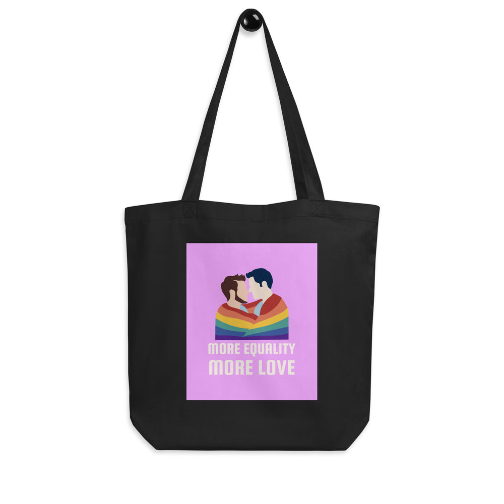 Front view of a black tote bag with two men kissing under a rainbow and the words “MORE EQUALITY MORE LOVE.”