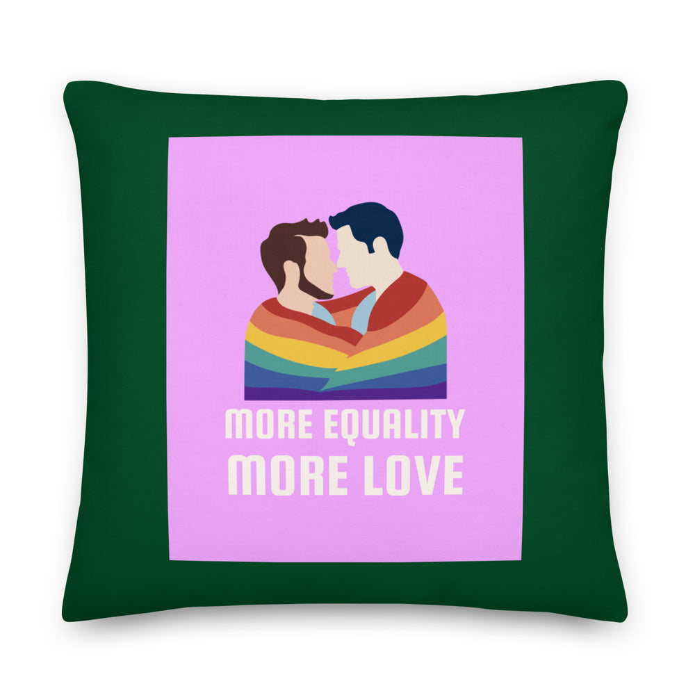 Front view of a dark green pillow with two men kissing under a rainbow and “MORE EQUALITY MORE LOVE”