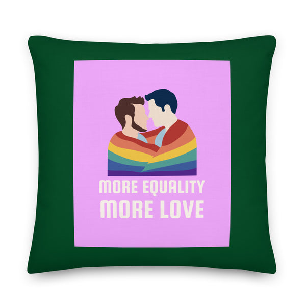 Front view of a dark green pillow with two men kissing under a rainbow and “MORE EQUALITY MORE LOVE”