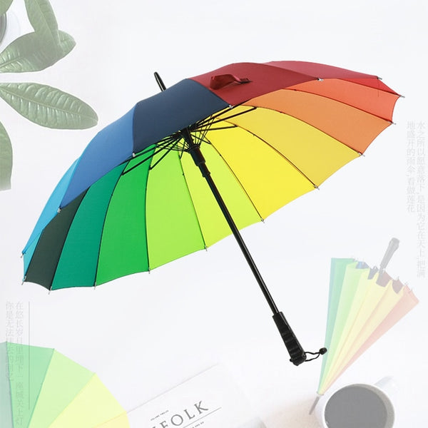 Open rainbow-striped umbrella with a black long handle and wrist strap