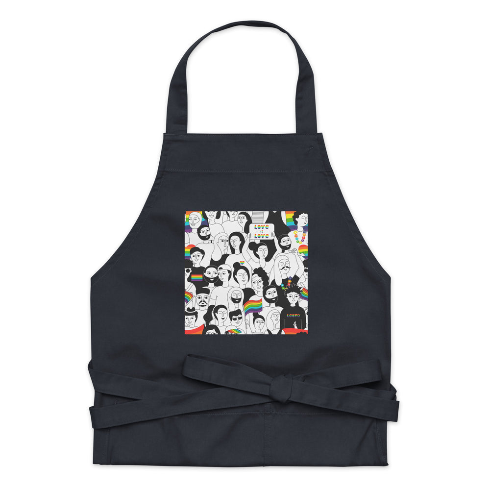 Front-facing black apron with a colorful Pride-themed illustration and tied waist straps
