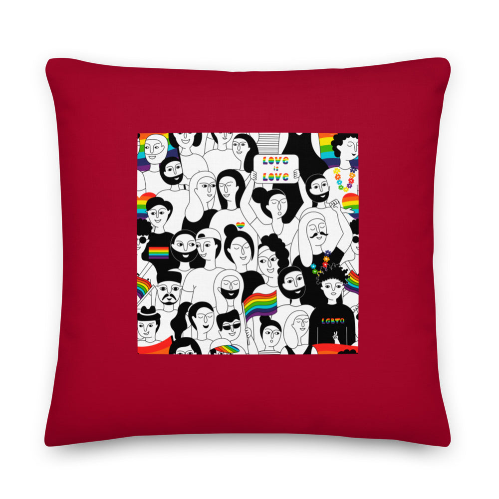 Front-facing red square pillow with a colorful illustrated Pride crowd and “LOVE IS LOVE” sign