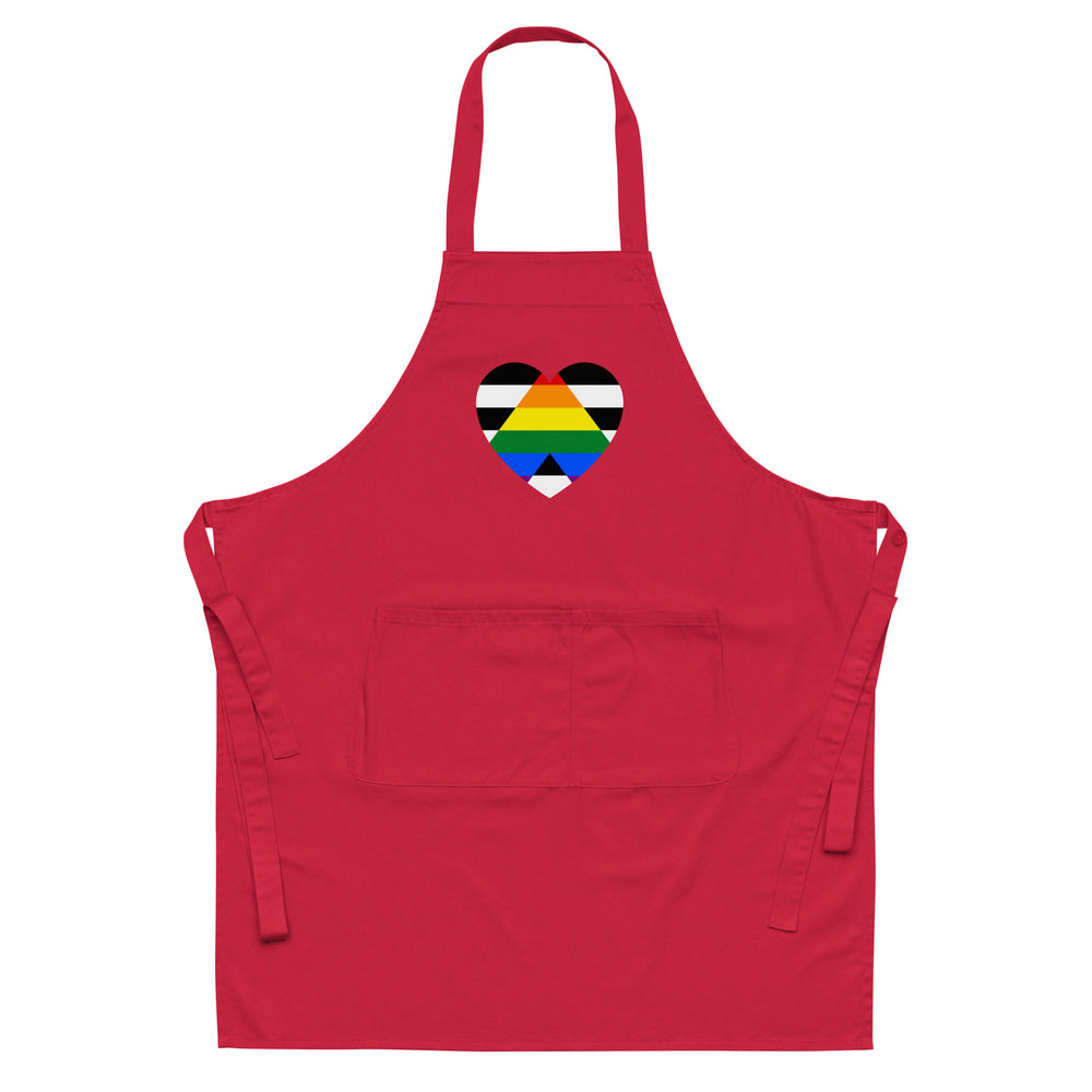 Front view of a red apron with neck strap, waist ties, pocket, and rainbow-striped heart emblem