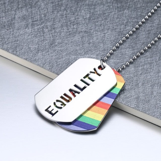 Silver ball-chain necklace with an “EQUALITY” tag over a rainbow-striped pendant