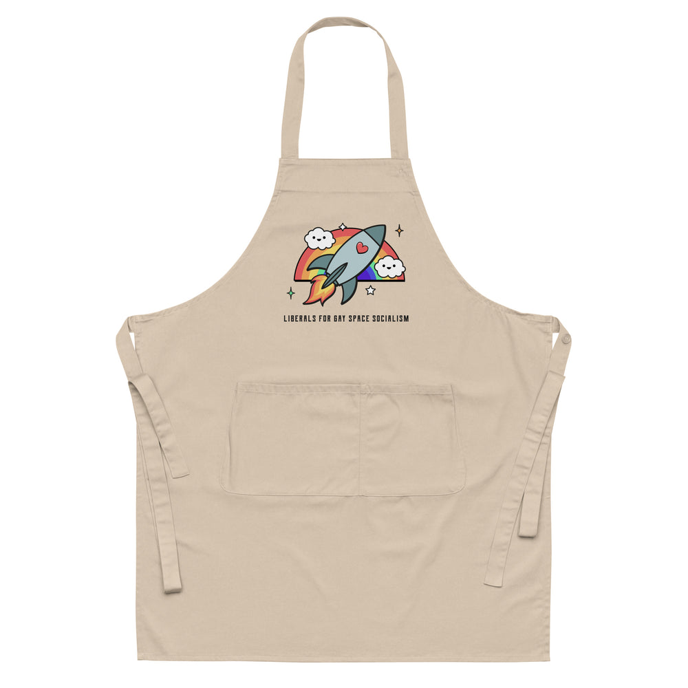 Beige apron with a rainbow rocket graphic and “LIBERALS FOR GAY SPACE SOCIALISM” text