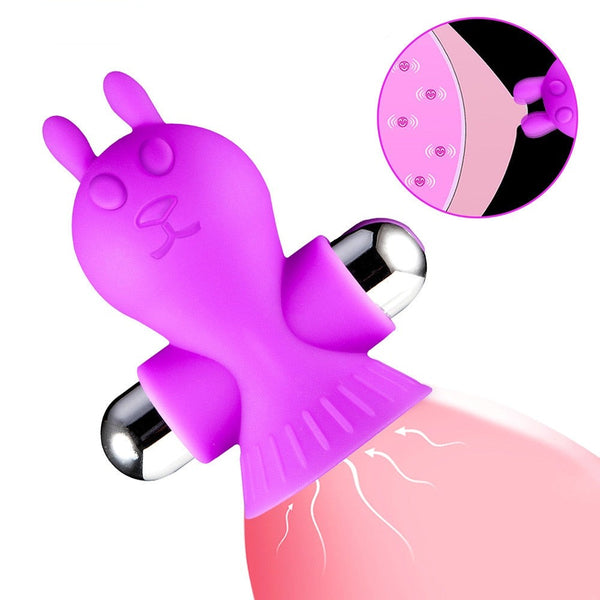 Purple bunny-shaped vibrating nipple clamp shown on pink fabric, with a mode-control inset