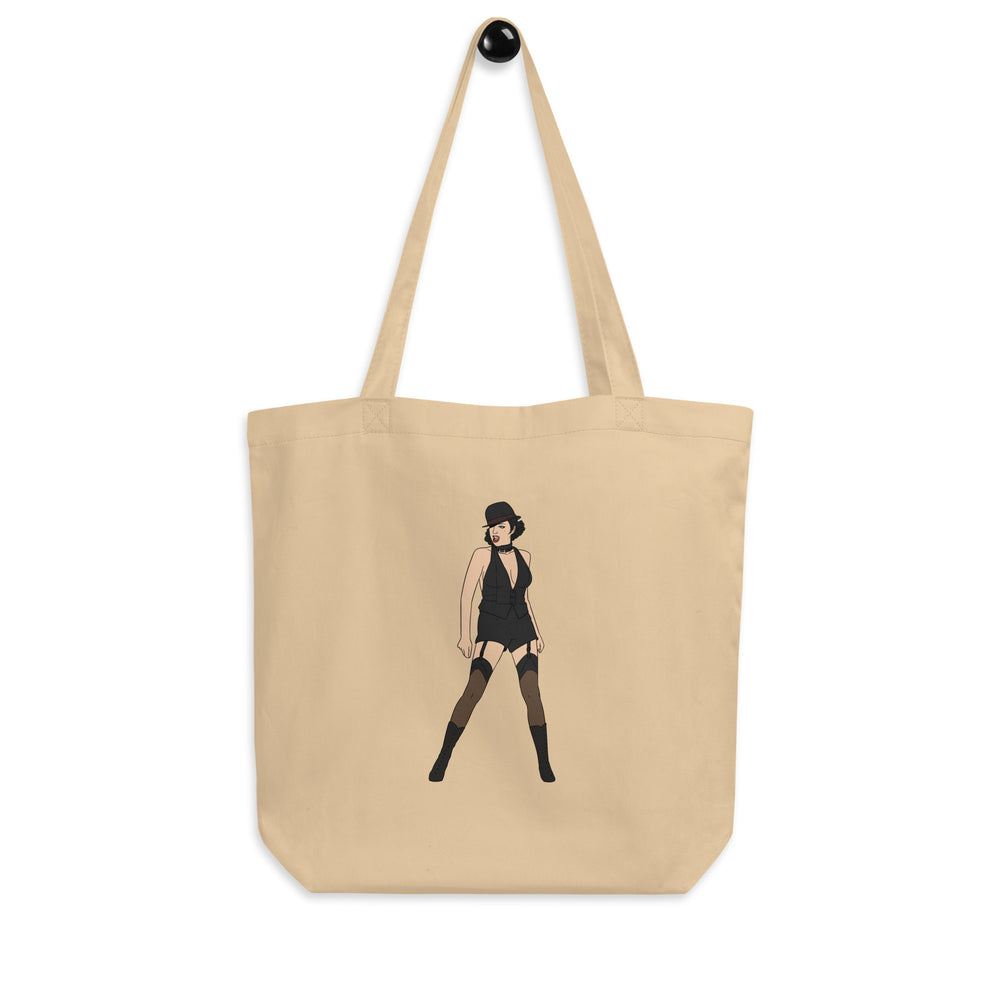 Front view of a beige tote bag with a stylized woman in a black cabaret outfit