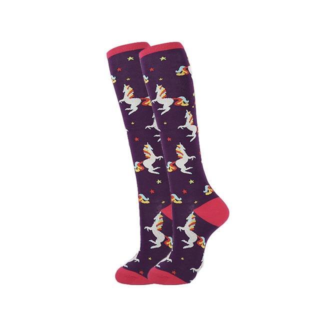 Long purple knee-high socks with colorful unicorns, stars, and pink cuffs and toes