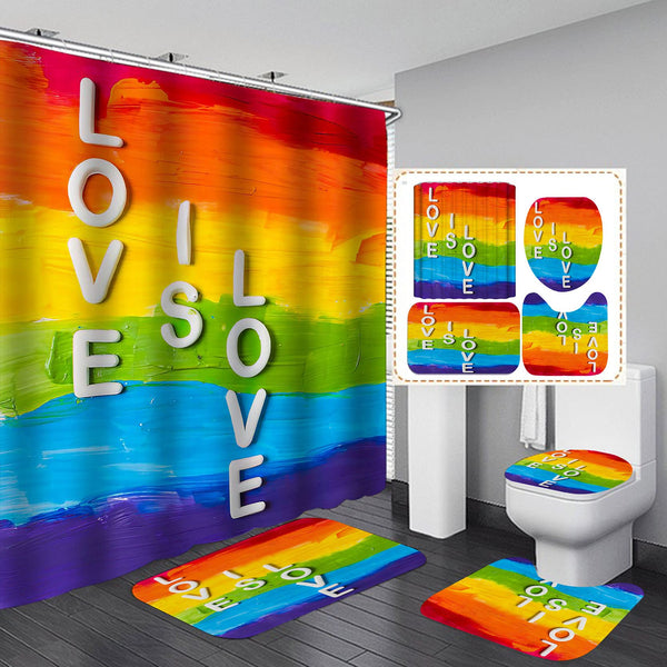Rainbow-painted bathroom set with a shower curtain and mats spelling “LOVE IS LOVE”