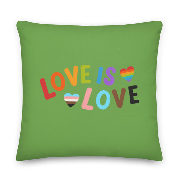 Green square pillow with colorful “LOVE IS LOVE” lettering and two striped hearts
