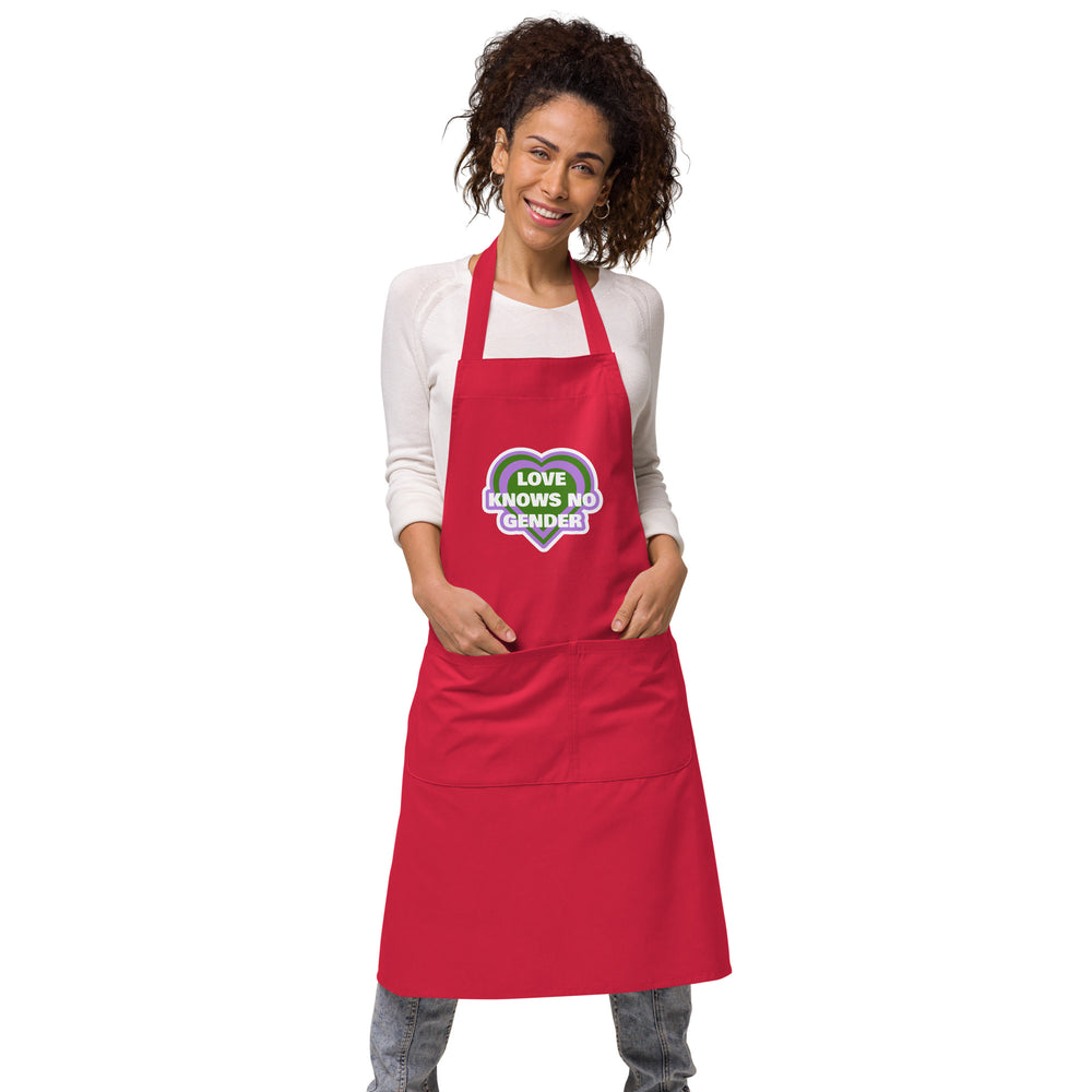 Front-view model wearing a red apron with a heart graphic reading “LOVE KNOWS NO GENDER”