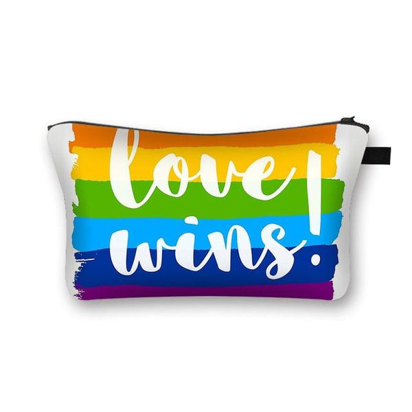 Rainbow Pride cosmetic pouch with white “Love wins.” lettering and black zipper