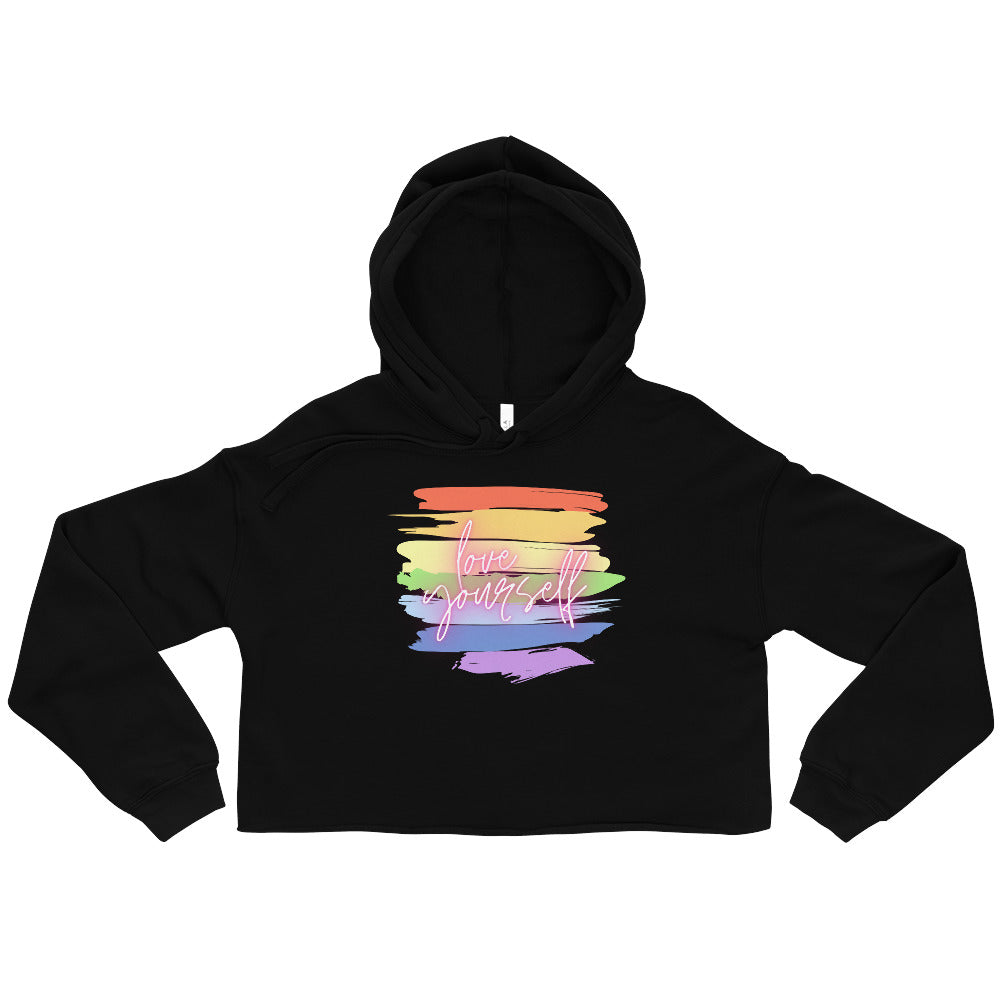 Front view of a black cropped hoodie with a rainbow brushstroke graphic reading “love yourself”