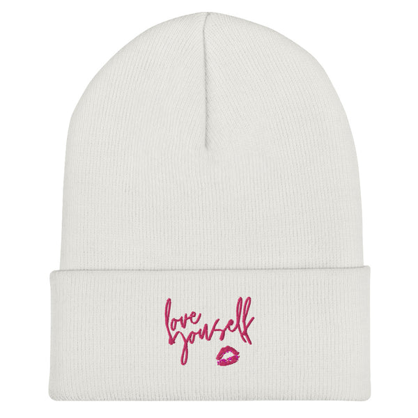 White cuffed beanie with pink “Love yourself” script and lips graphic
