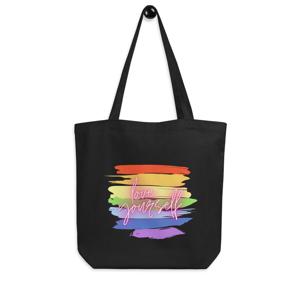 Front view of a black tote bag with colorful brush strokes and “love yourself” lettering