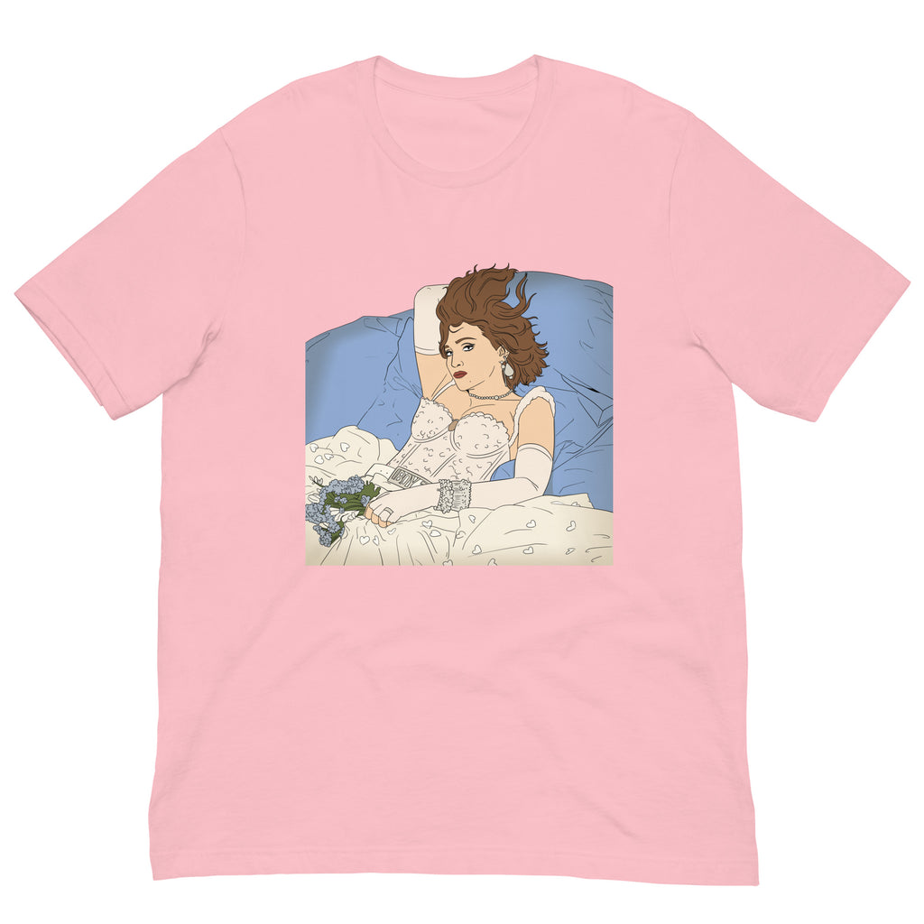 Front view of a pink T-shirt with a vintage-style illustration of a woman reclining in bed