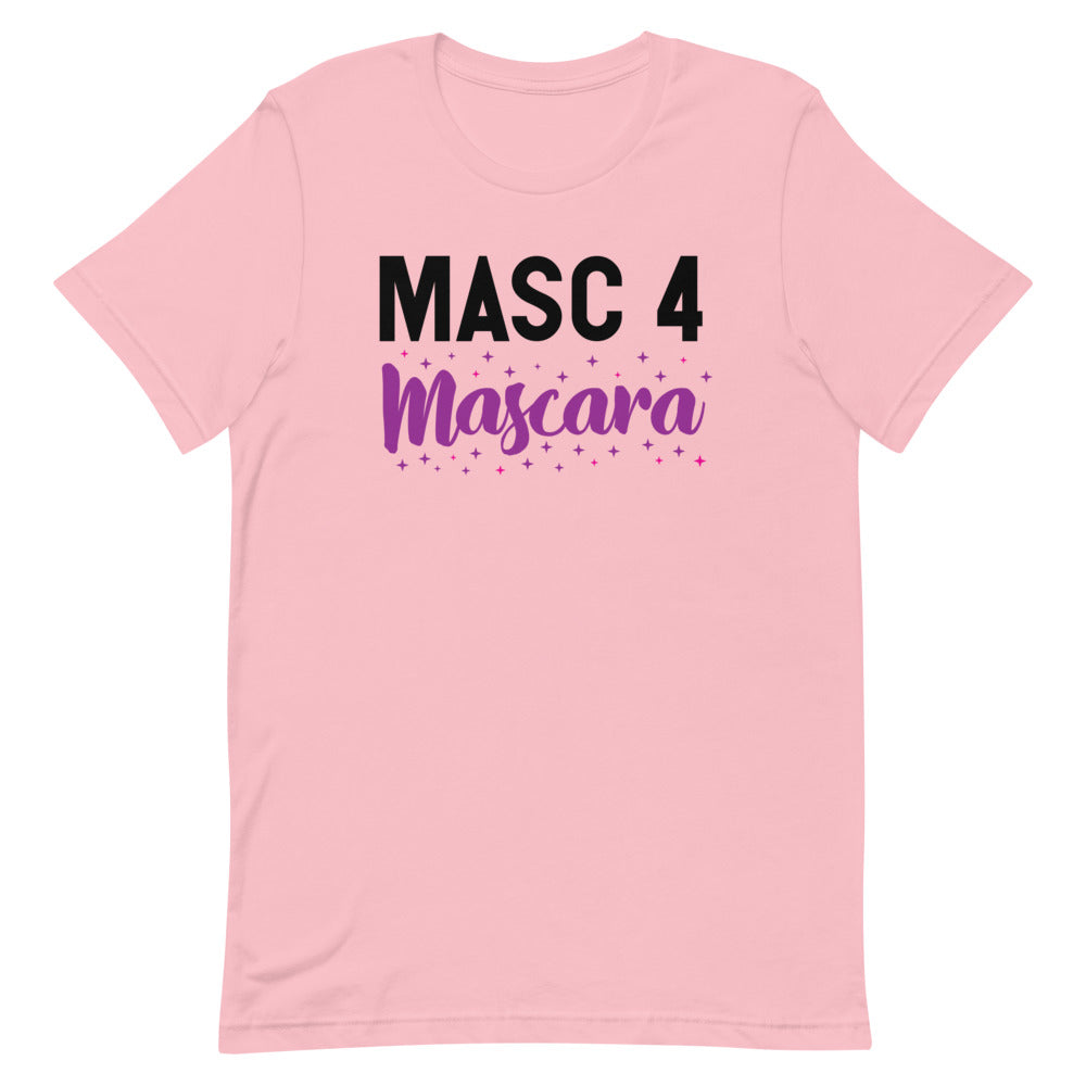 Masc 4 Mascara T-Shirt in light pink with bold black “MASC 4 Mascara” slogan and sparkles, worn by a young man in a pink-lit queer club.