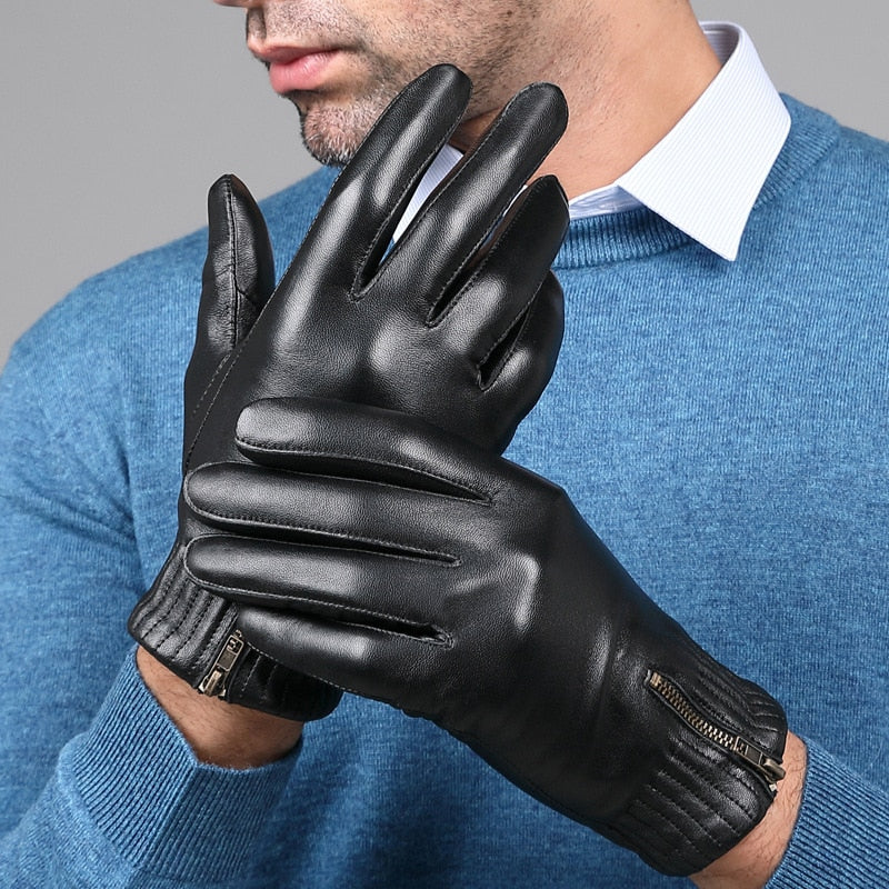 Close-up of a person wearing black leather gloves with zippered cuffs