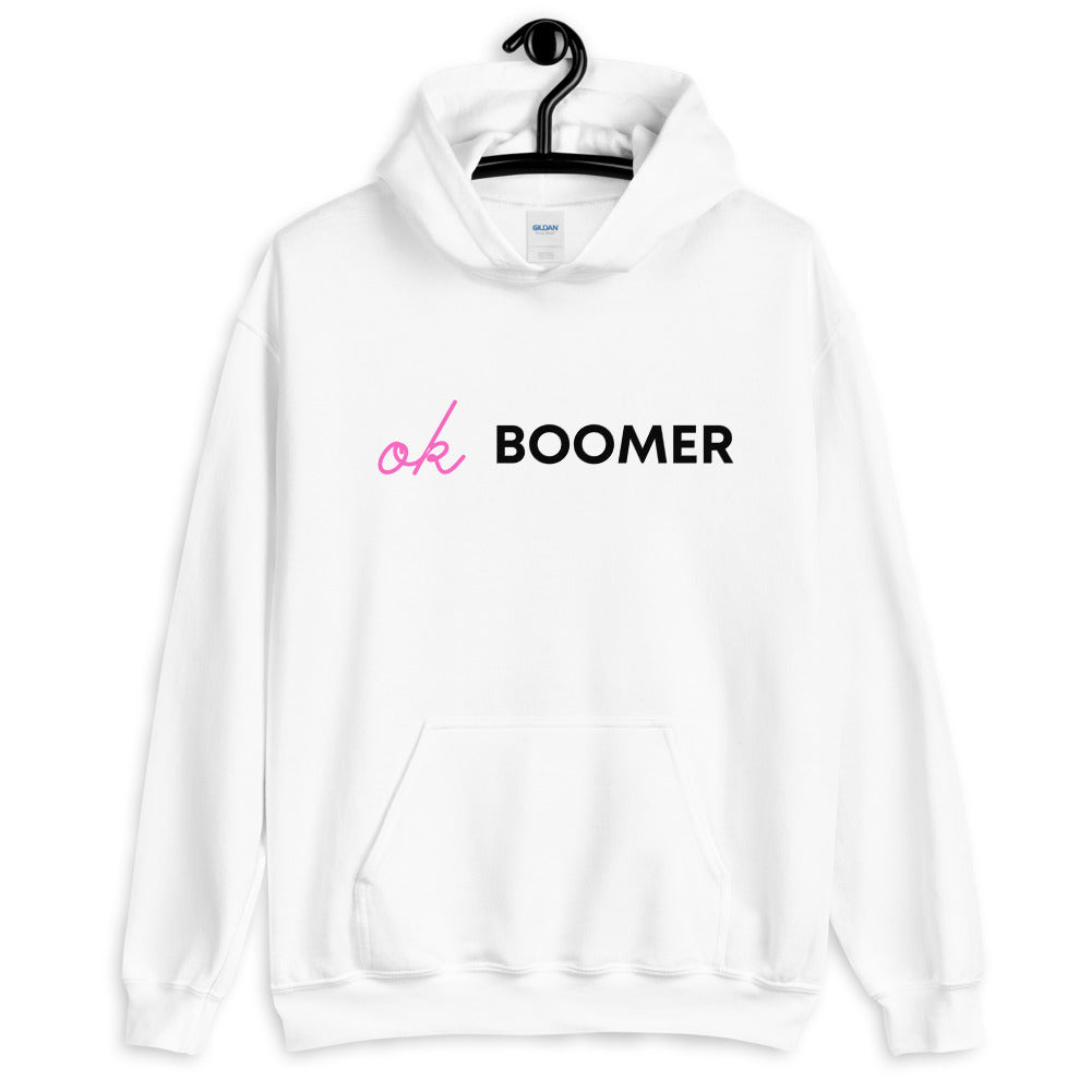 White unisex hoodie on a hanger with pink and black “ok BOOMER” lettering