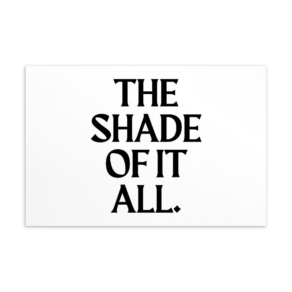 White postcard with bold black typography reading “THE SHADE OF IT ALL.”