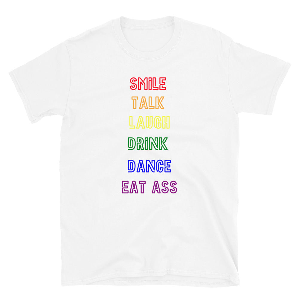 White T-shirt with stacked rainbow text reading “SMILE TALK LAUGH DRINK DANCE EAT ASS”