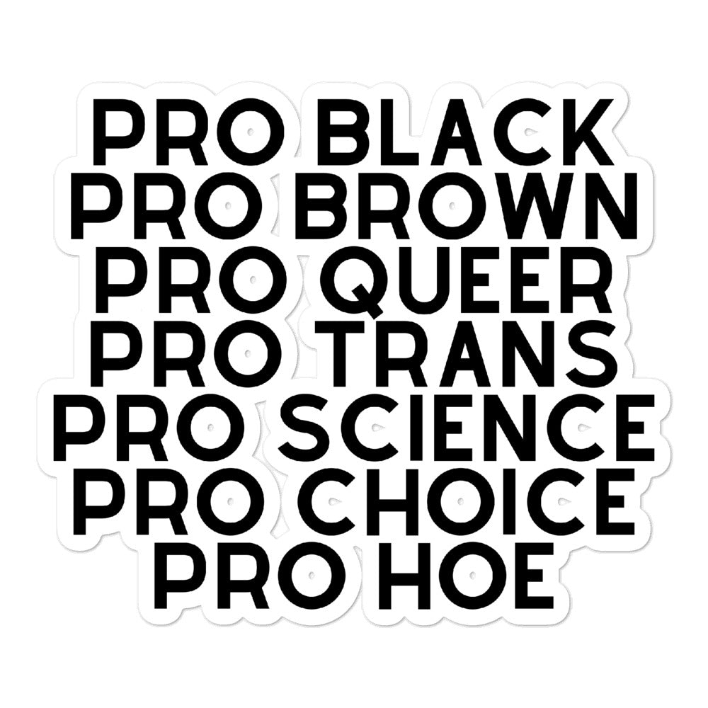 Close-up of stacked black-and-white stickers reading “PRO BLACK,” “PRO BROWN,” “PRO QUEER,” and more