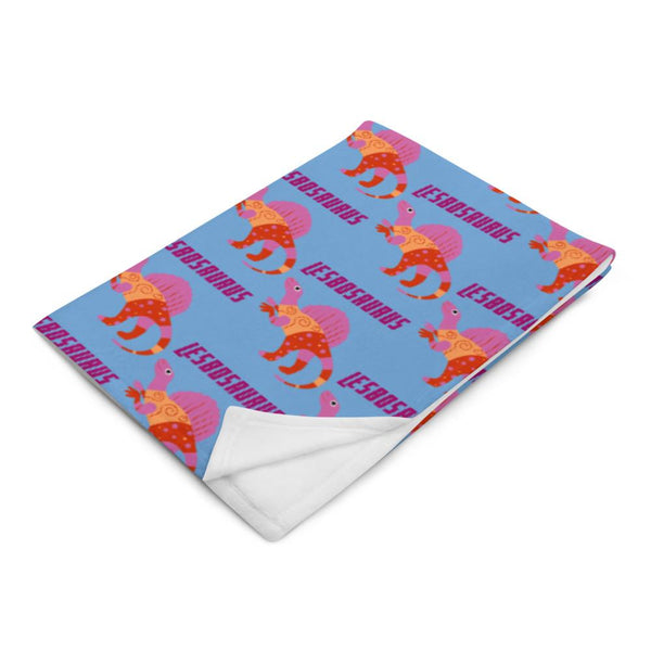 Blue Lesbosaurus throw blanket with repeating colorful dinosaur illustrations and text, corner folded back