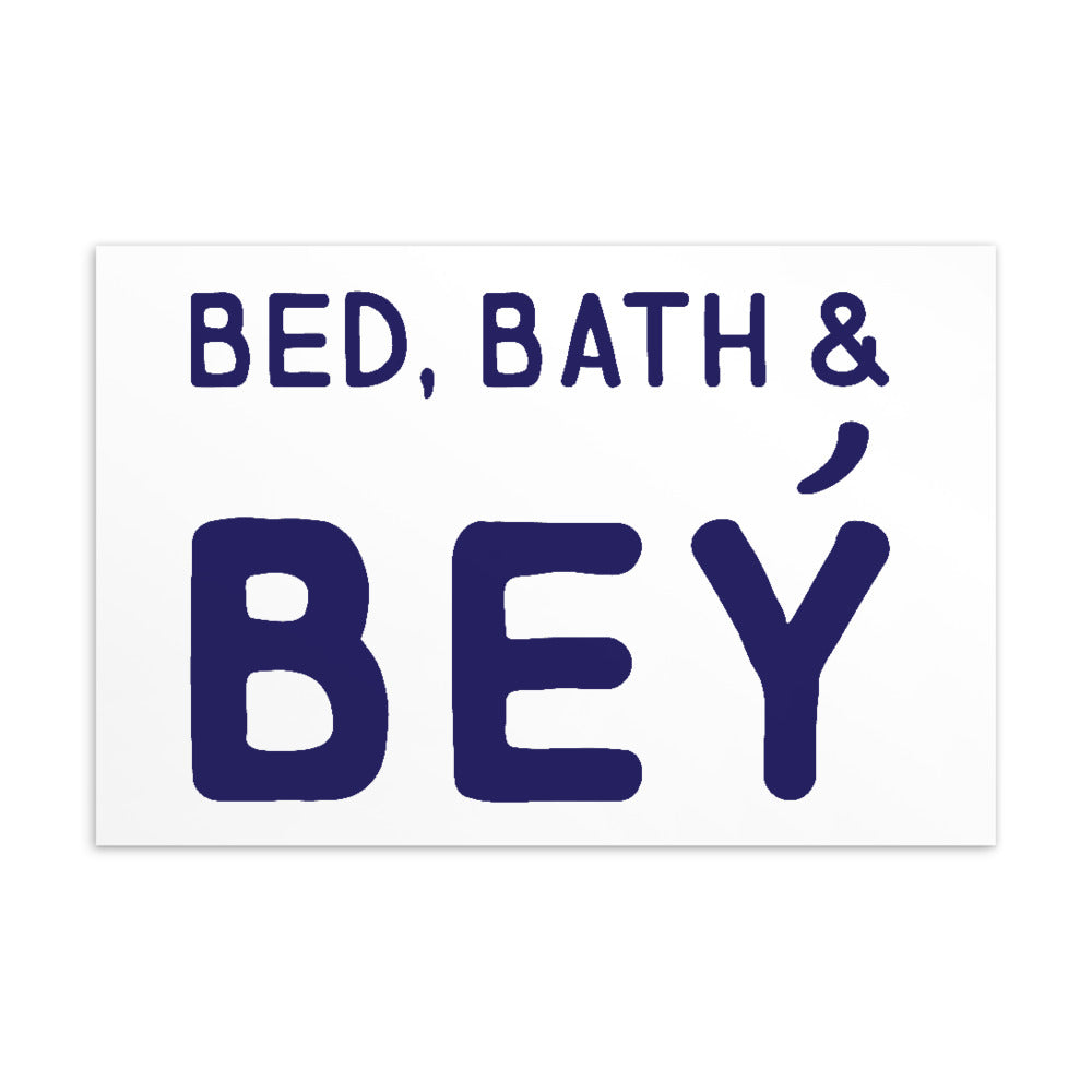 White postcard with dark blue lettering reading “BED, BATH & BEY”